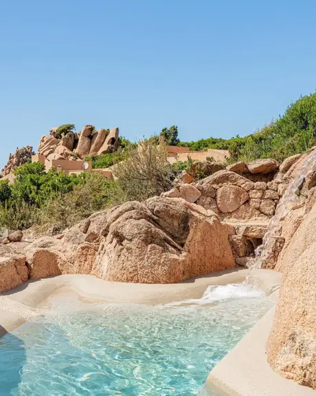 Rock-edge pool with a natural waterfall feature