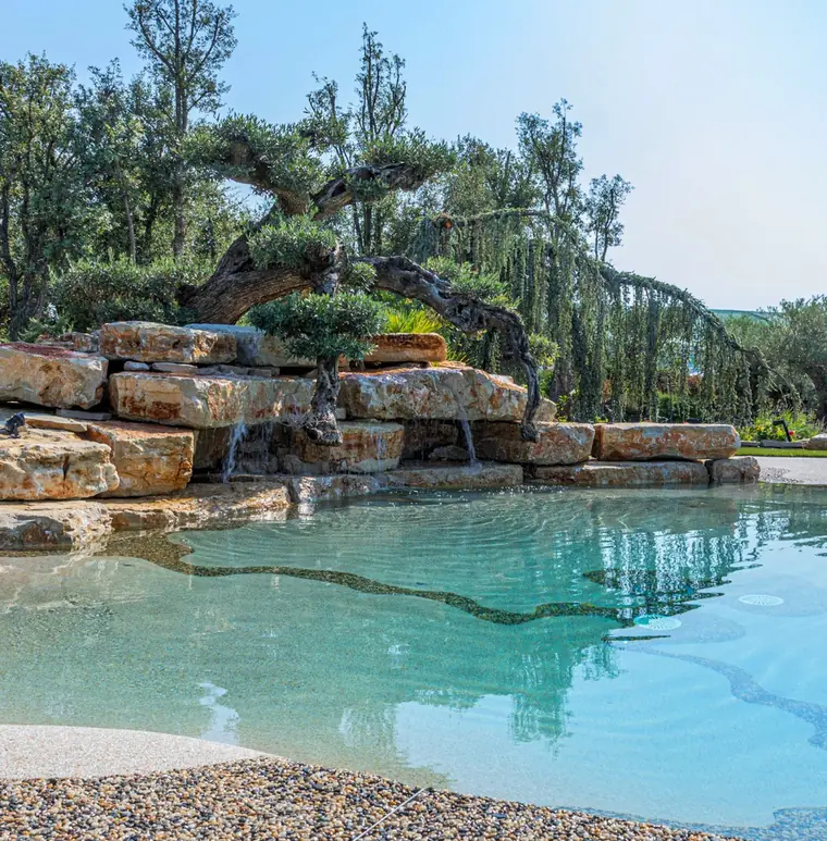 Rock-edge pool with a natural stone waterfall